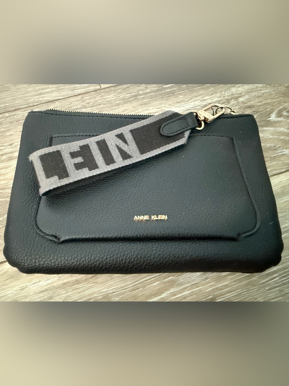 Anne Klein Black Wristlet with Gold Logo Accent and Gray Strap